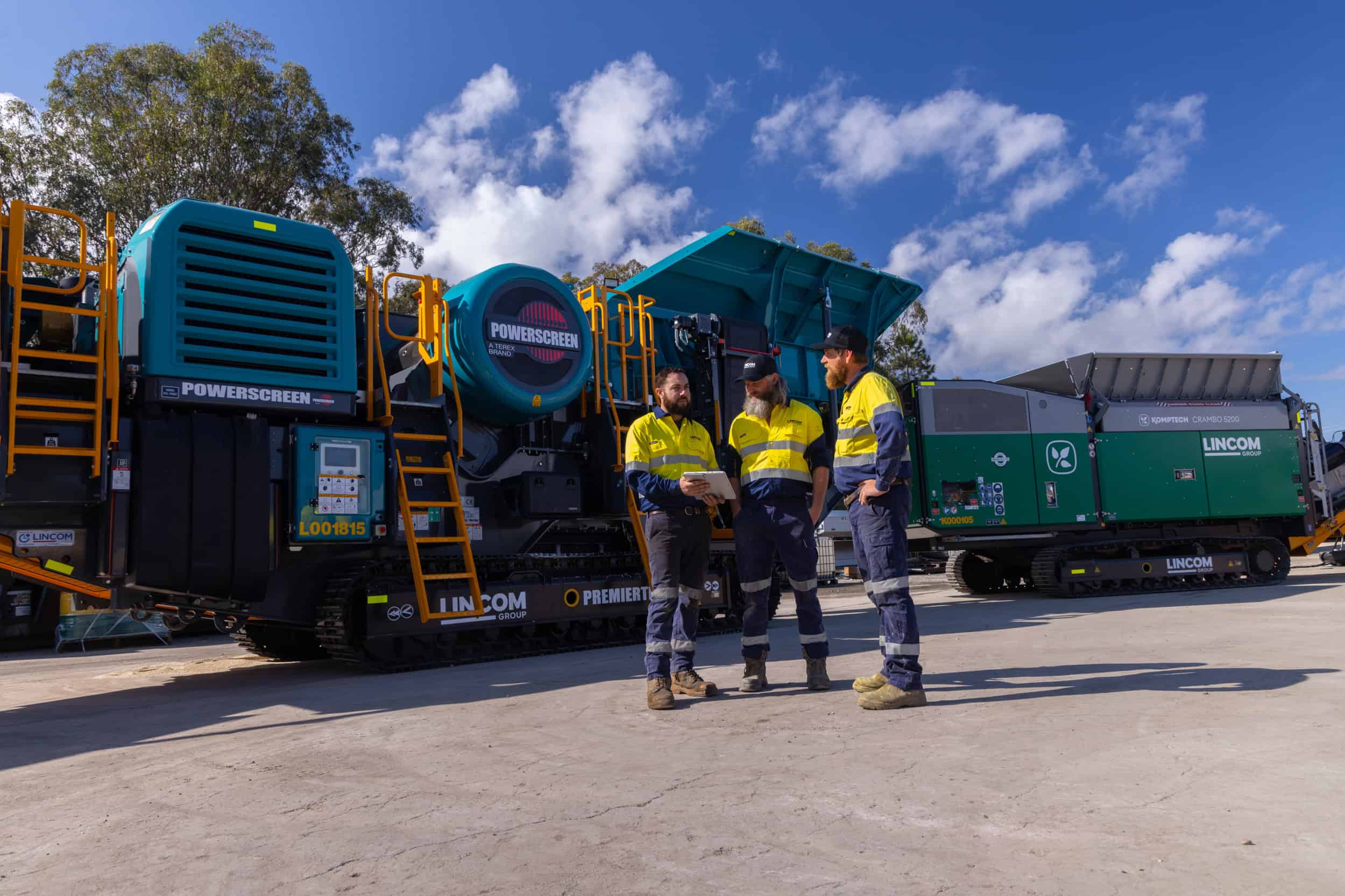 Lincom Group technicians discussing equipment operations
